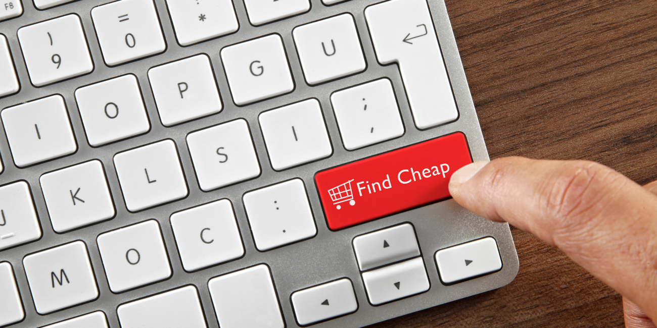 Close-up of a keyboard with a red key labeled 'Find Cheap' being pressed, symbolizing easy access to cheap laptops for sale online.