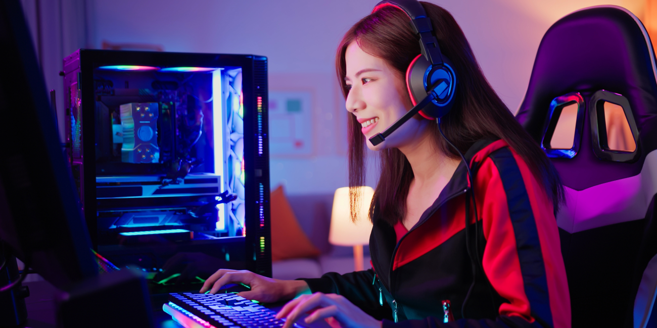 A gamer enjoying a high-performance gaming PC setup with RGB lighting, showcasing where to buy gaming PC in South Africa for an immersive experience.